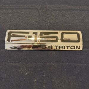 04 08 FORD F150 LARIAT 5.4 TRITON FENDER  EMBLEM 4L34 16B114 GB